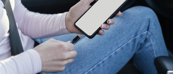 woman-charging-her-phone-car